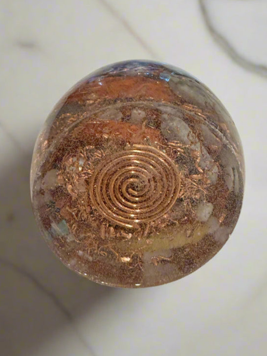 Decorative wall piece with spiral design on a marble wall